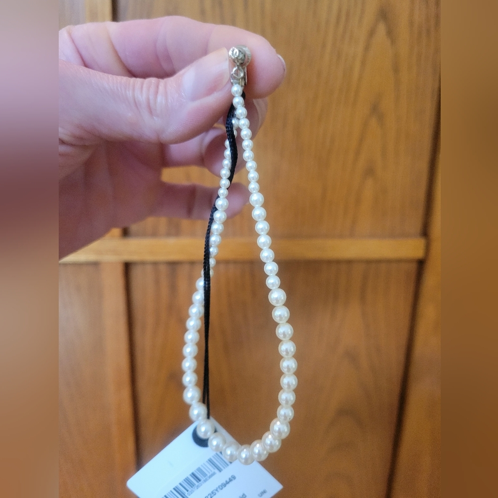 A beautiful pair of long pearl CHANEL tear drop earrings!